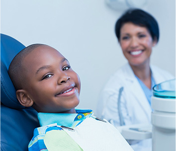 happy child smiling with a dentist